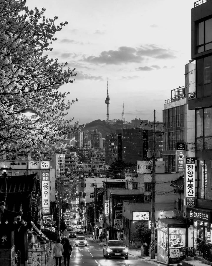 A street in Seoul, Namsan Tower on the hill behind.